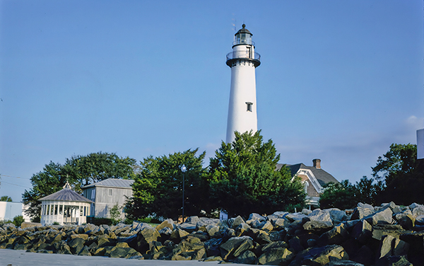 St. Simons Island Lighthouse and museum beside the rocky shoreline in Glynn County, Georgia