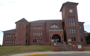 Historic Sumter County Courthouse with brick façade and clock tower in Americus, Georgia