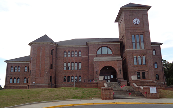 Historic Sumter County Courthouse with brick façade and clock tower in Americus, Georgia