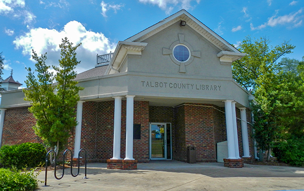 Talbot County Public Library building with entrance columns and bike rack in Talbotton, Georgia