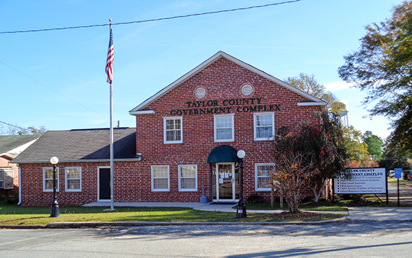 Taylor County Government Complex brick building with flagpole in Butler, Georgia