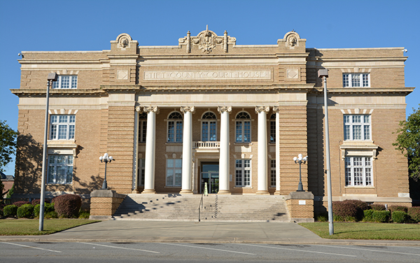 Tift County Courthouse with columns and tan brick facade in Tifton, Georgia