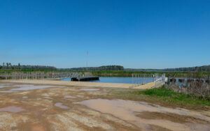 Public boat ramp and floating docks at Tired Creek Lake in Grady County, Georgia