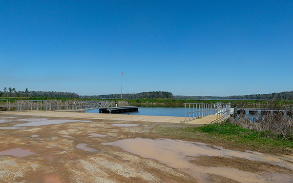 Public boat ramp and floating docks at Tired Creek Lake in Grady County, Georgia