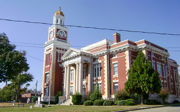 Historic Turner County Courthouse in Ashburn, Georgia, a 1907 red-brick building with a domed clock tower and white columns