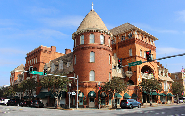 Historic Windsor Hotel with red-brick architecture, tower and street corner in downtown Americus, Georgia