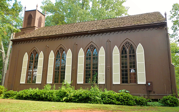 Historic Zion Episcopal Church with Gothic windows and white shutters in Talbotton, Georgia