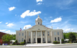 Historic white Chattooga County Courthouse with clock tower in Summerville, Georgia