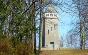 Stone Chenocetah Fire Tower reached by steps and surrounded by trees near Cornelia, Georgia