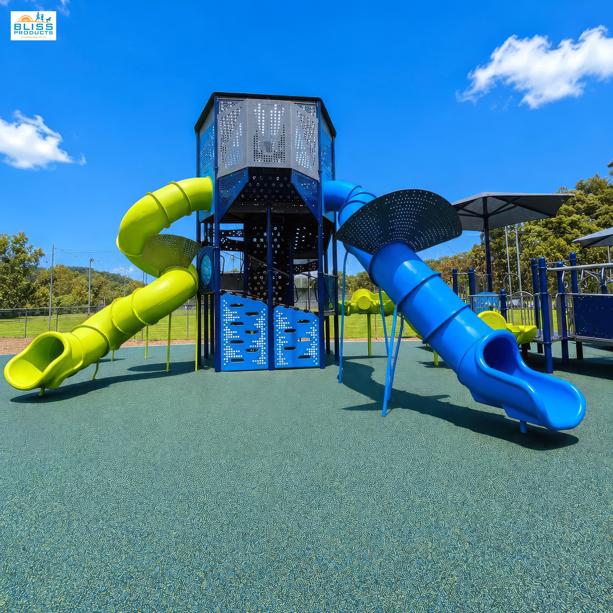 Front view of the Olympus Tower with blue and lime-green tube slides at Clay County Sports Complex in Hayesville, North Carolina.