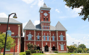 Red brick Clayton County Courthouse with clock tower in Jonesboro, Georgia