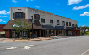 Historic storefronts, sidewalks, and a street intersection in downtown Cornelia, Georgia