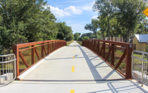 Concrete pedestrian and bicycle bridge with rust-colored railings on the Firefly Trail in Athens, Clarke County, Georgia