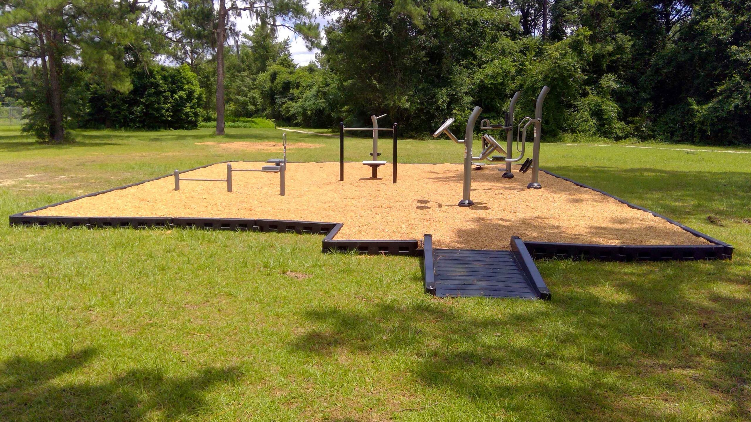 Accessible outdoor fitness course beside the walking trail at Fort Braden Community Center in Leon County, Florida