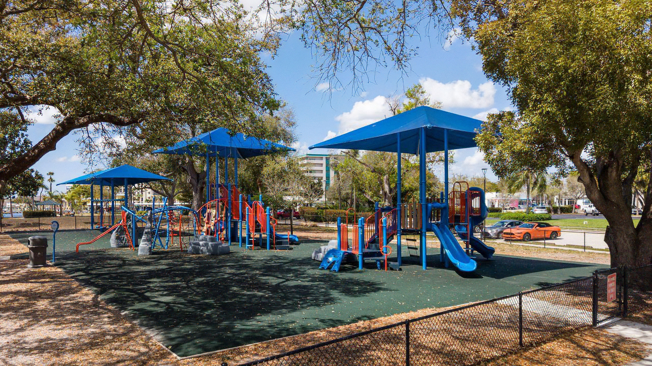 Shaded playground structures at Four Freedoms Park in Cape Coral, Florida