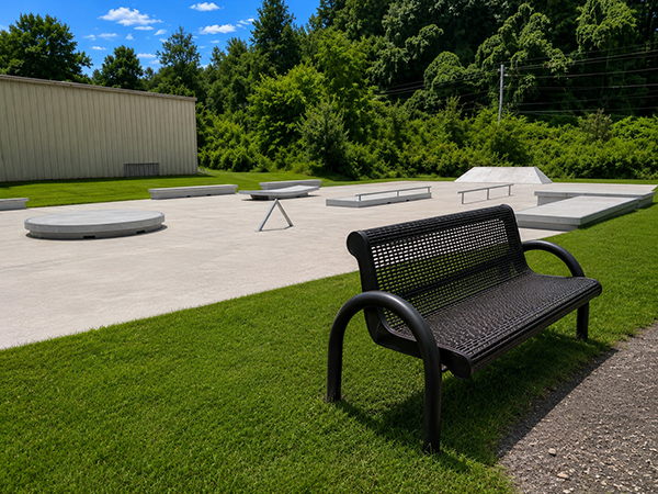 Concrete skate park with bench, rails, ledges and bank at Mark Watson Park in Sylva, North Carolina