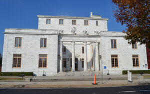 Historic white stone Cherokee County Courthouse with columns in Canton, Georgia