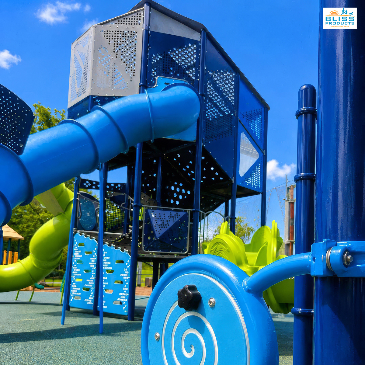 Ground-level interactive play feature with the Olympus Tower and blue tube slide at Clay County Sports Complex in Hayesville, North Carolina.