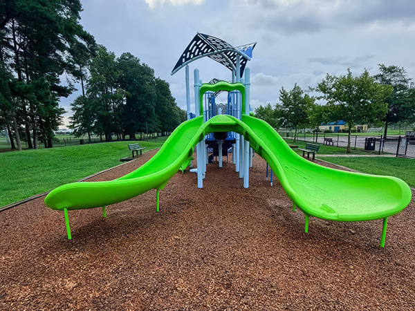 Two lime-green slides at the Princess Anne Athletic Complex playground in Virginia Beach, Virginia