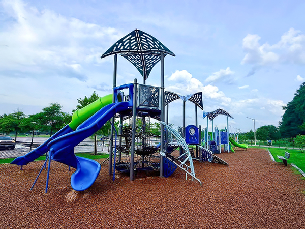 Main playground structure with blue and lime-green slides at Princess Anne Athletic Complex in Virginia Beach, Virginia