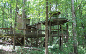 Wooden treehouse and elevated walkways among the trees at Sawnee Mountain Preserve in Forsyth County, Georgia